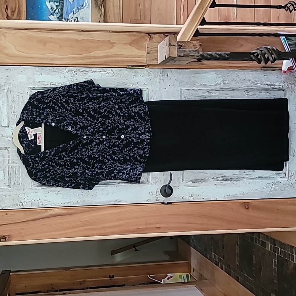 Long black sleeveless dress with short sleeve jacket.